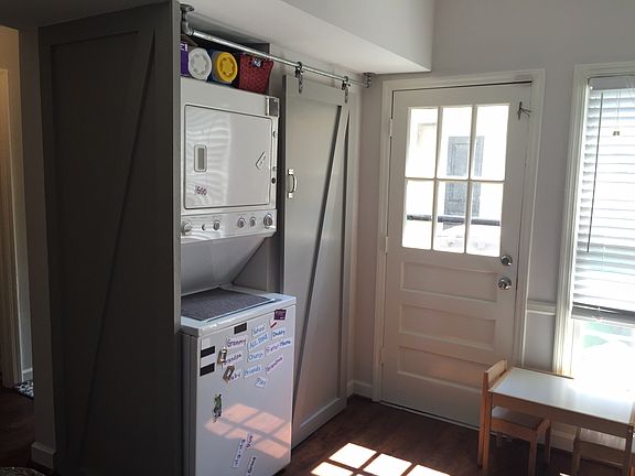 Barn door hides washer dryer