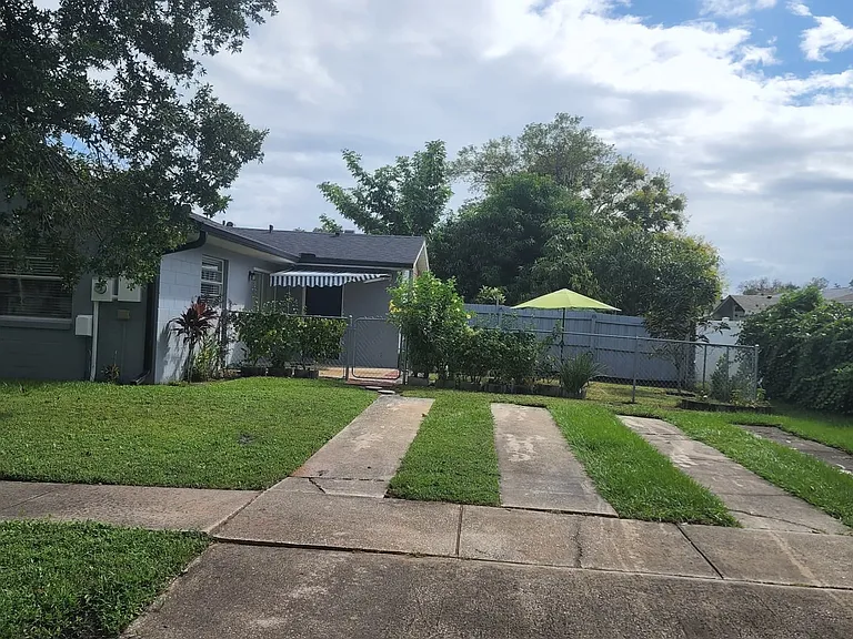 Side entrance with 2 parking spaces.