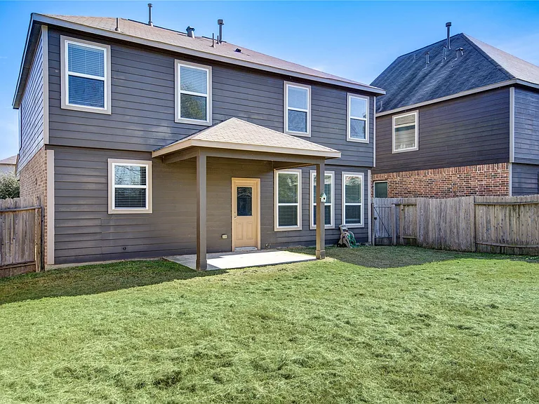 10907 Woodland Leaf Ln — Photo 32