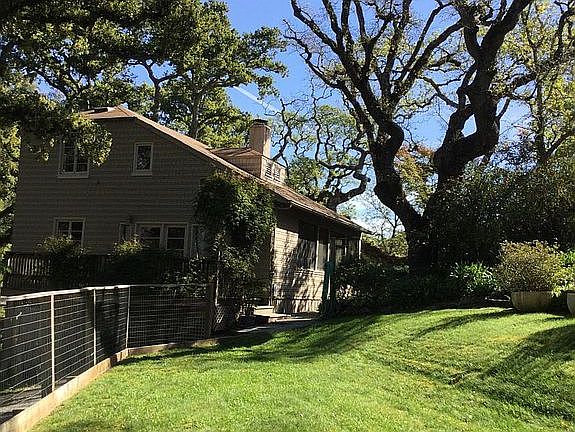 1 1/2 story home with fenced yard