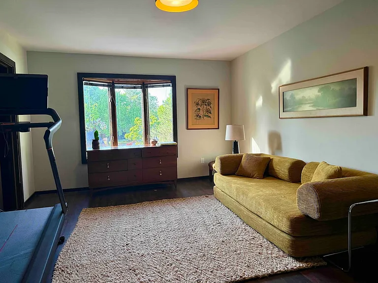 3rd bedroom with convertible king bed and Peleton