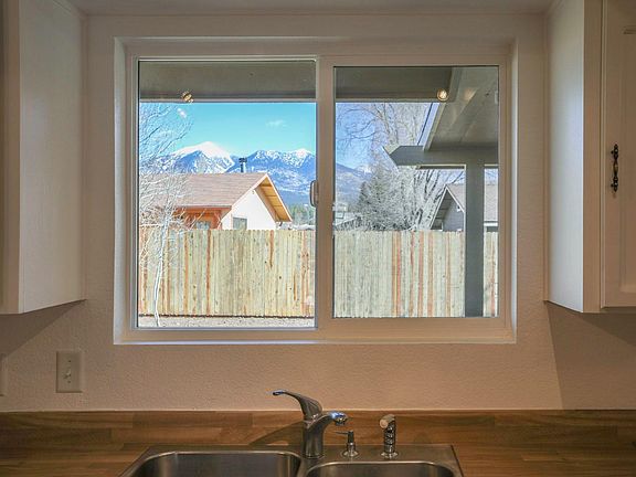 Peak view from Kitchen window over new rear fence