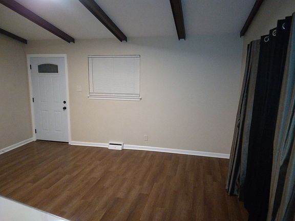 Living roomnew laminate flooring, new windows in whole house