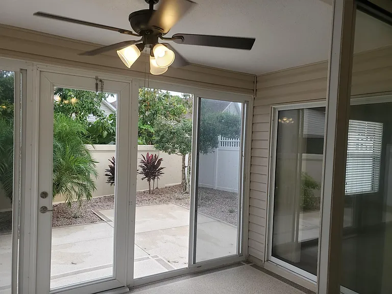 Lanai is inclosed with newer windows and has a ceiling fan