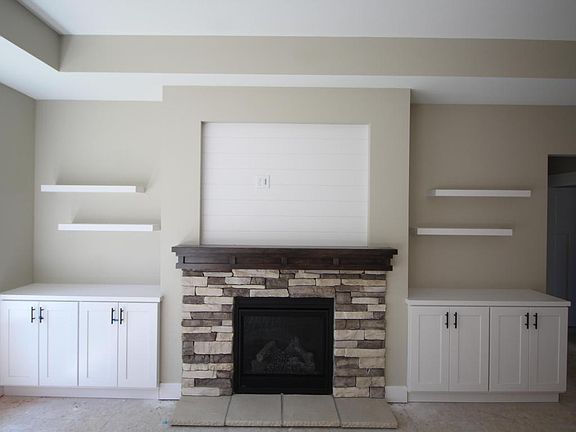 Gas fireplace in great room with builts  ins.