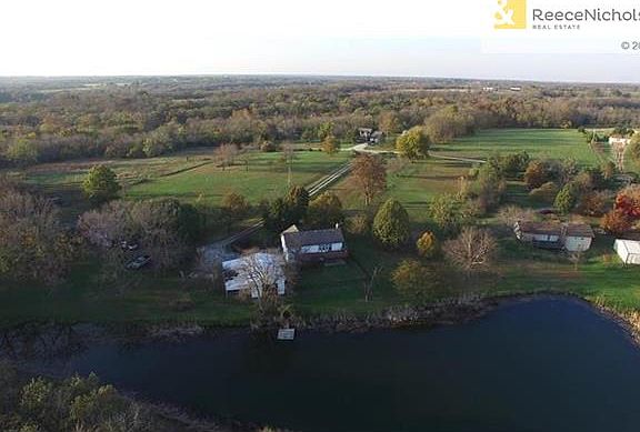 What a view! Home shares ownership rights to this stocked pond with 2 neighbors.