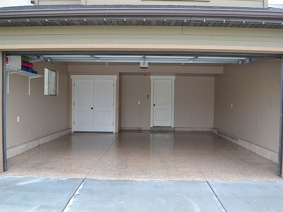 2 car garage with epoxy floo