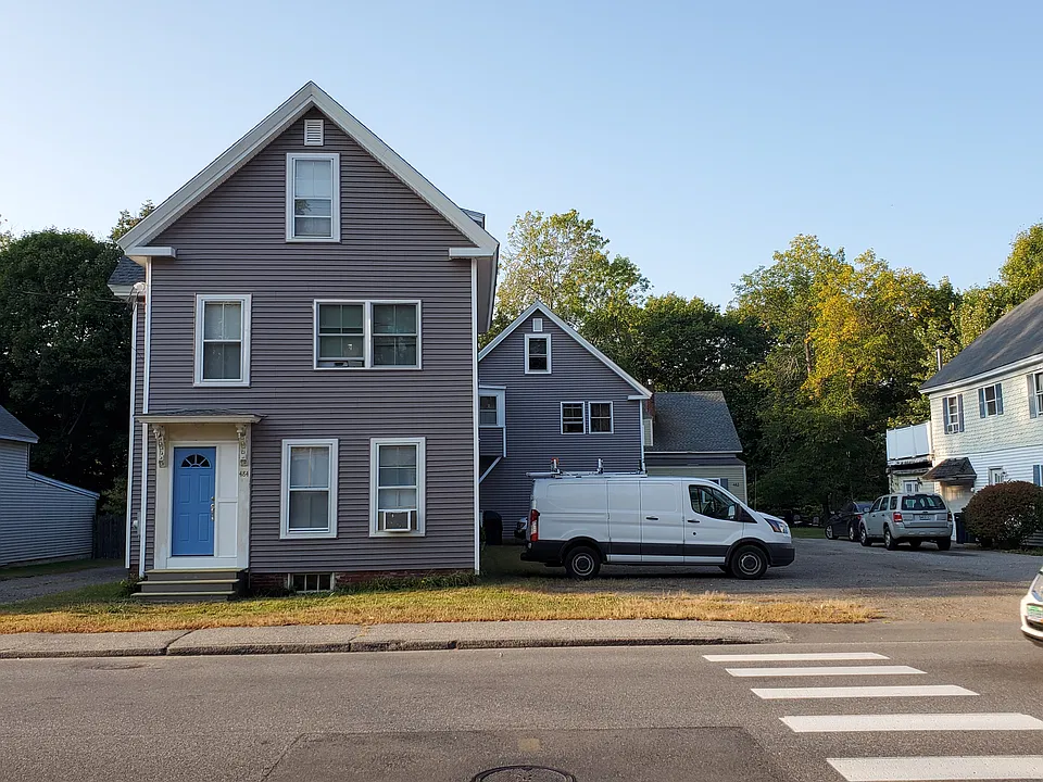 484 Main ST has two buildings connected by a common area with stairs. The building was recently resided.