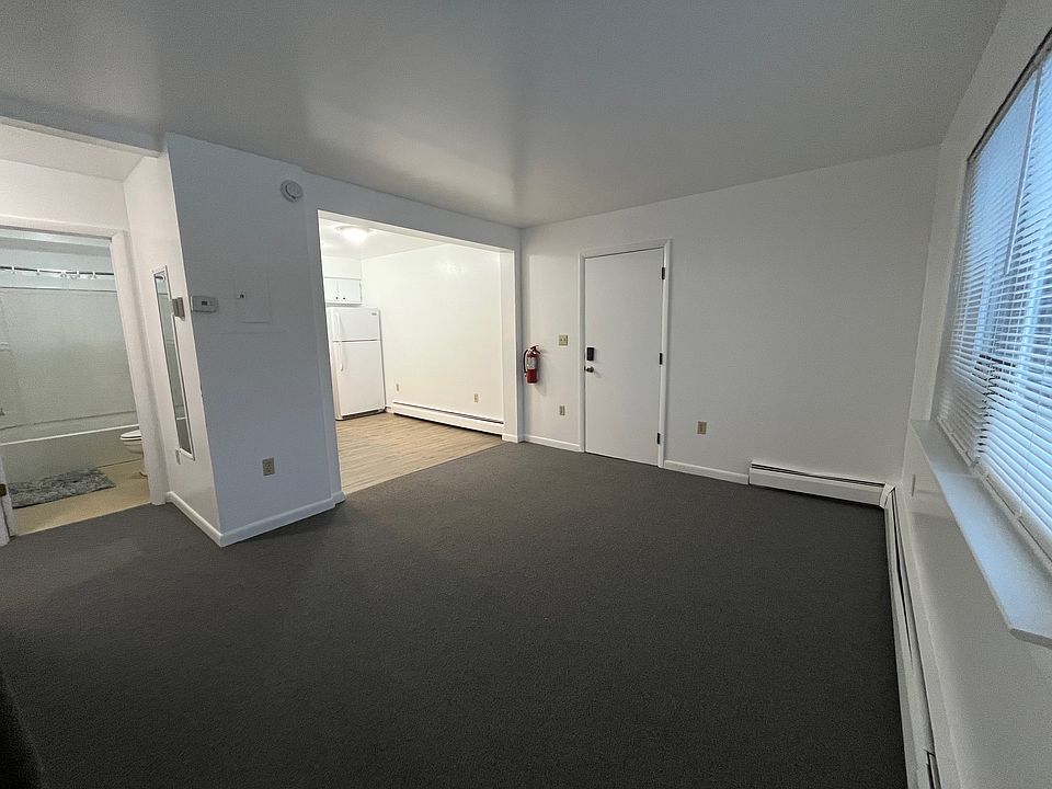 Living room looking into kitchen. Bathroom on the left and 2 bedroom just down the hall