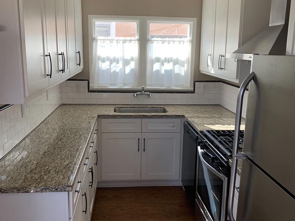 sunny kitchen, next to dinette area and bartop