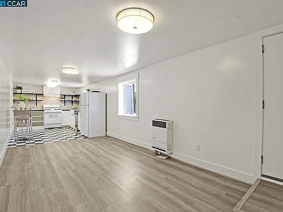 Main room - kitchen at one end, bathroom off kitchen
