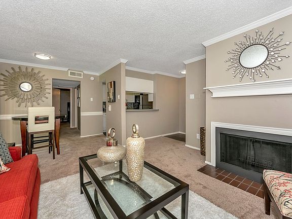 Spacious living room with fireplace and large windows for natural light
