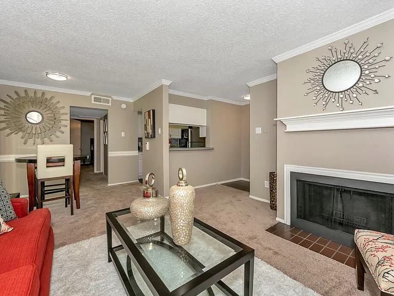 Spacious living room with fireplace and large windows for natural light