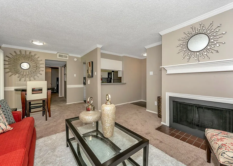 Spacious living room with fireplace and large windows for natural light
