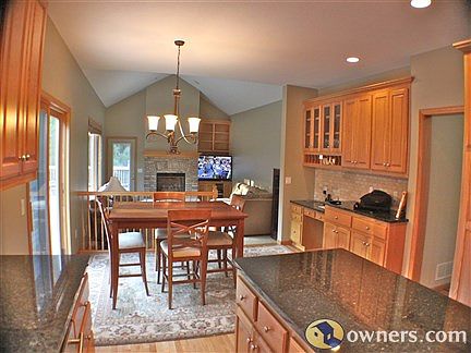 Open concept kitchen with large eat-in area open to family room.