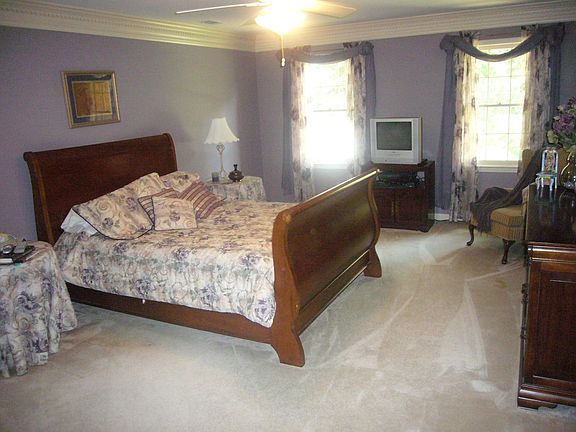 Master bedroom suite features walk-in closet and private bath.