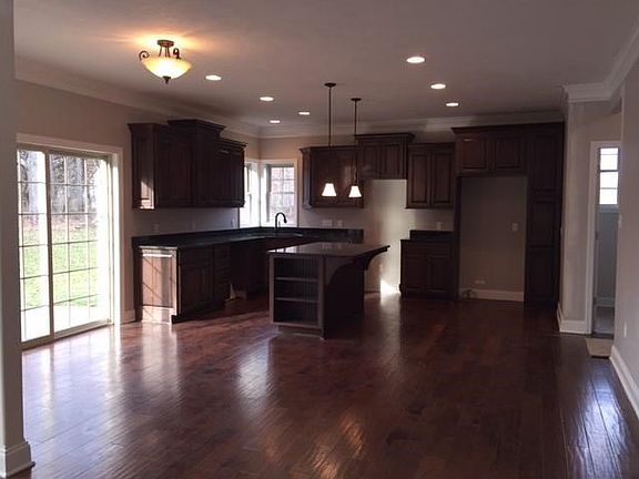 The spacious kitchen and dining area.  To the right is the main floor laundry room and also the entrance to the garage.