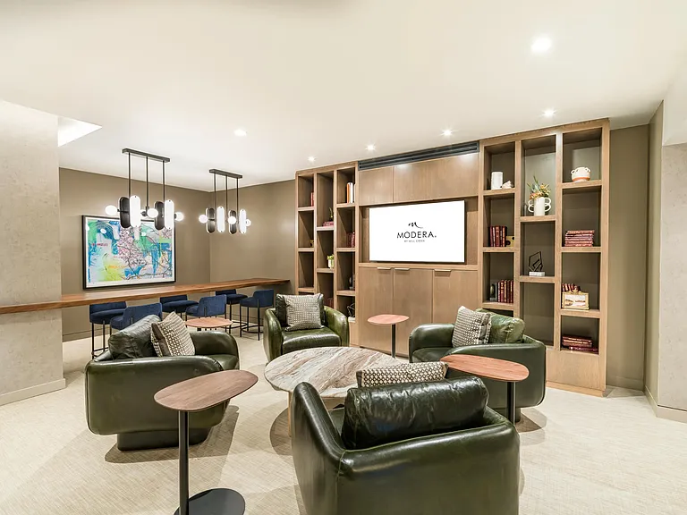 A coworking lounge, complemented by a private conference room and two private offices, offers residents a versatile workspace within the community.