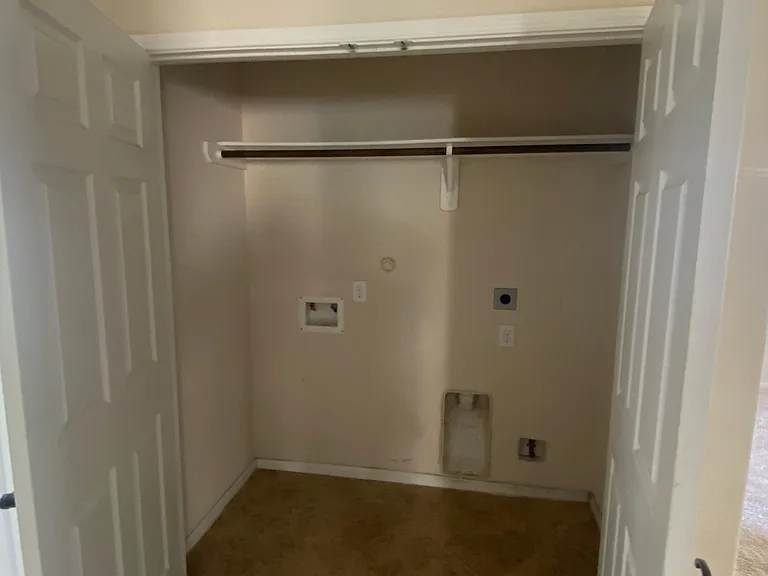 Laundry area fits full-sized appliances (not included)