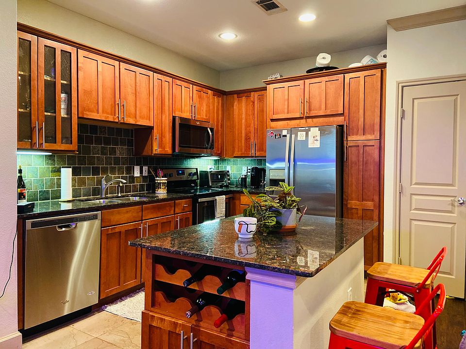 Great kitchen with wine rack and Plenty of cabinetry. With adjacent coat closet.