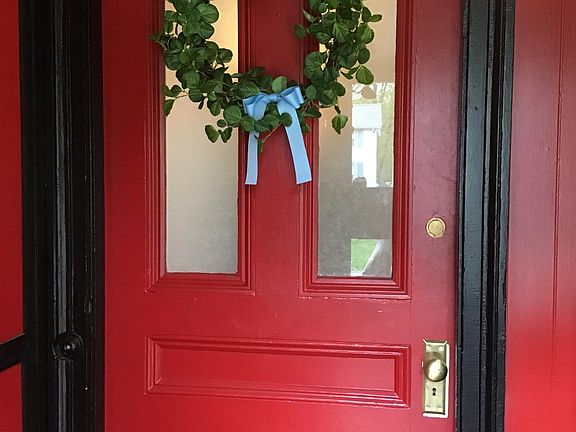 Front entry, with enclosed porch.