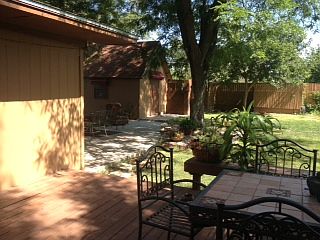 Back deck looking onto porch and shed