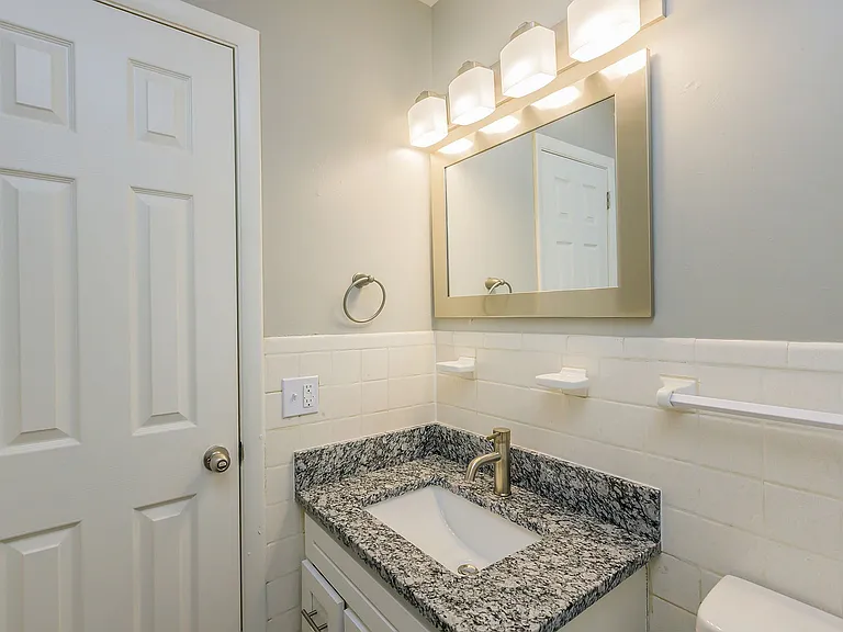 Bright bathroom with granite counters