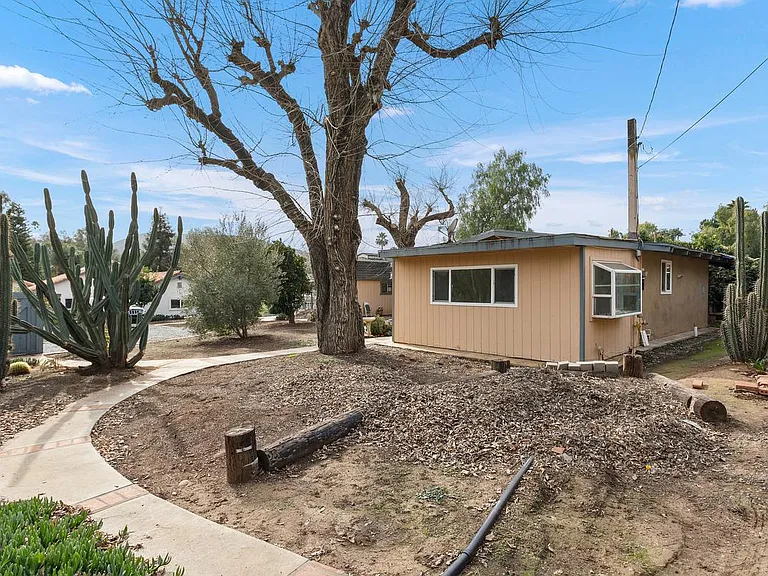 Path to tenant parking spot. 15x10 foot storage shed to the right for tenant's exclusive use.