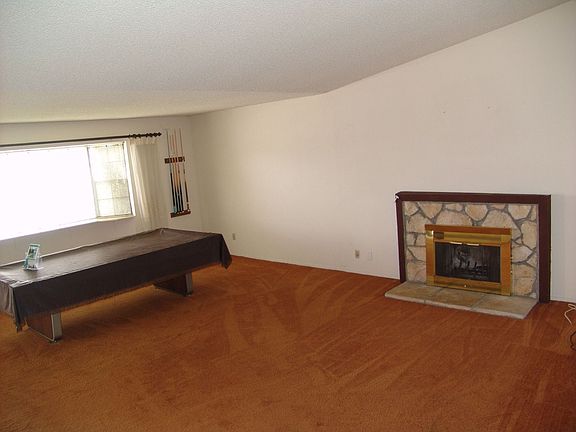 Living room-pool table, vaulted ceilings, fireplace