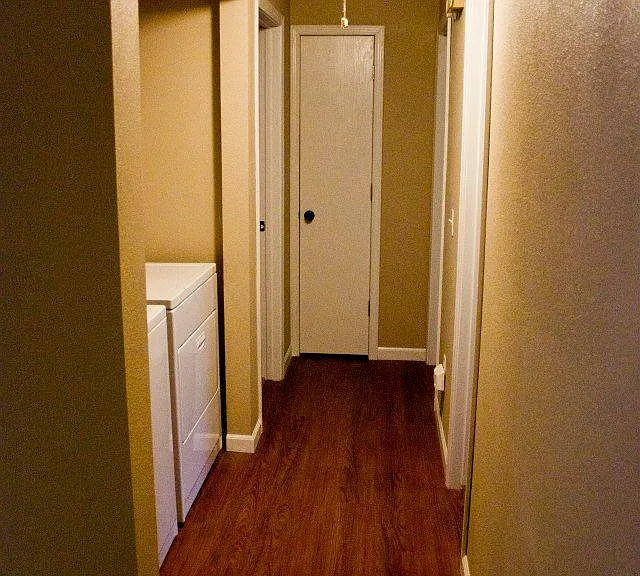looking down hall - laundry nook on left, bathroom across from it.
linen closet at end of hall with bedroom on either side of hall