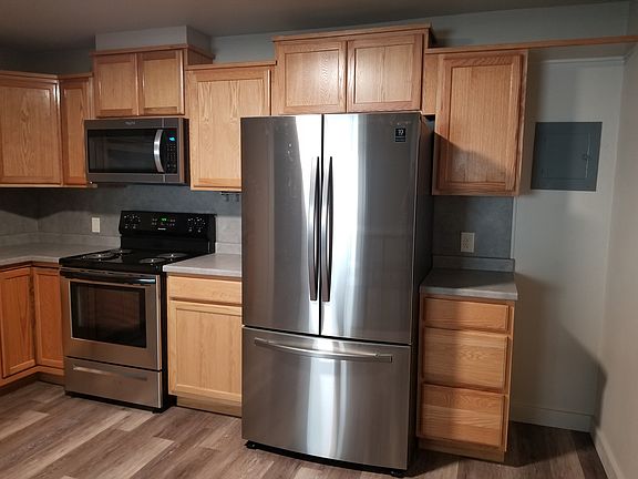 New refrigerator with ice maker, new self cleaning stove/oven & microwave.