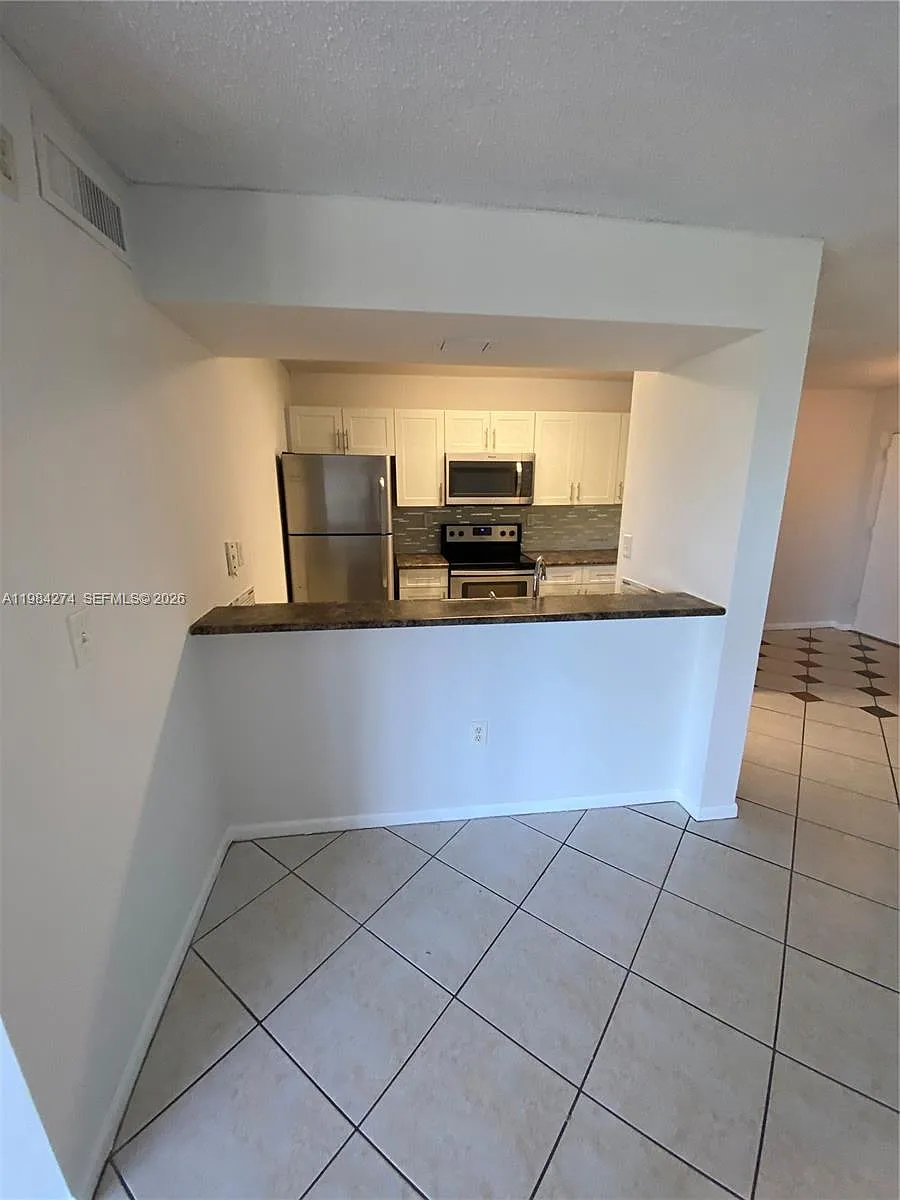 Building Photo - 7035 NW 186th St #D305