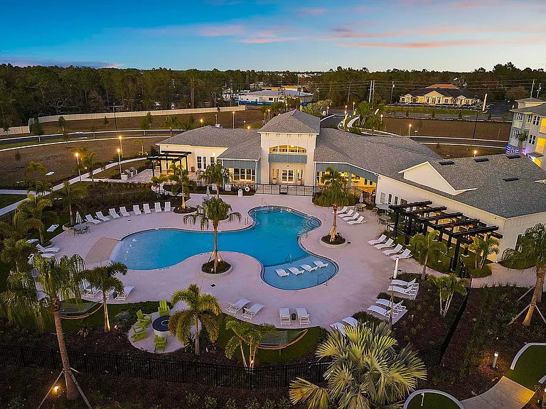 Experience the tranquility of resort-style living with this exquisite pool area, designed for relaxation and leisure.
