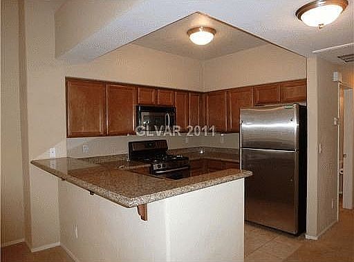 Kitchen with granite and stainless steel appliances