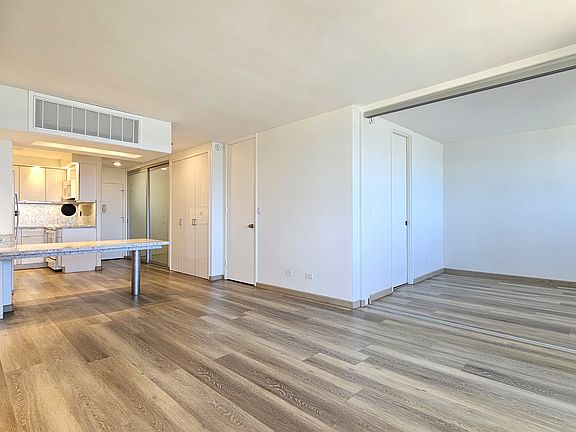 Living Room, facing into the South/Makai Bedroom, and facing the open kitchen