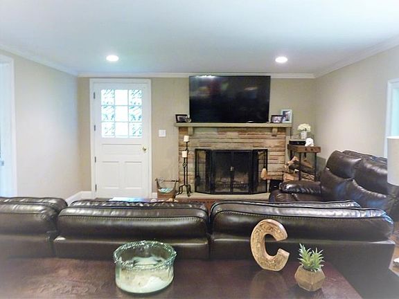 Spacious Living Room with a Gorgeous Wood Burning Fireplace