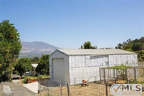 Dog pens, bird pens, and garden areas, family fruit trees include avocado, orange, lemon, lime, fig, apple guava, apricot, persimmon, plum, grapefruit.