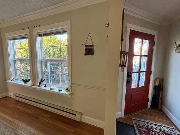 View of dining room and entry. Lots of natural light