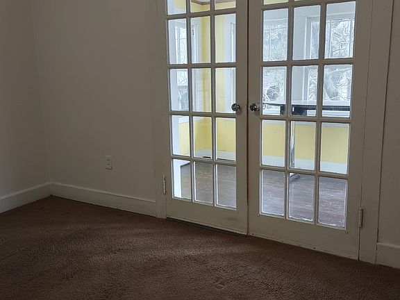 bedroom 1 looking into bonus sun room