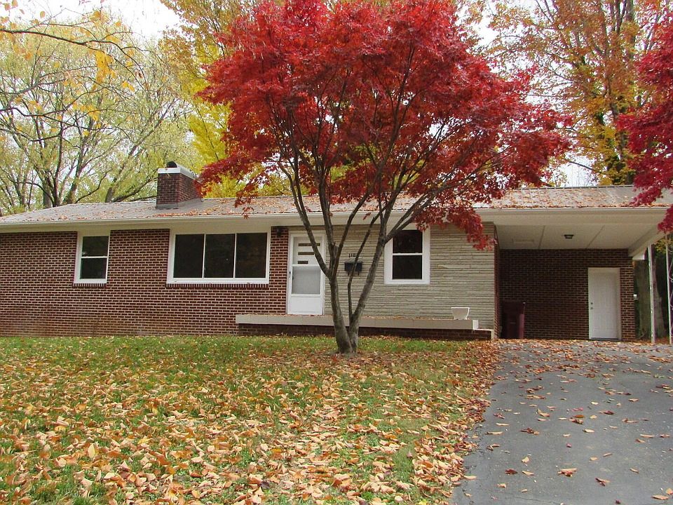 Front of the house. No front neighbors as it faces directly Rotary Park. Carport.
