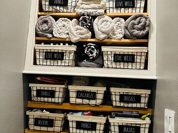 Organized bins in bathroom