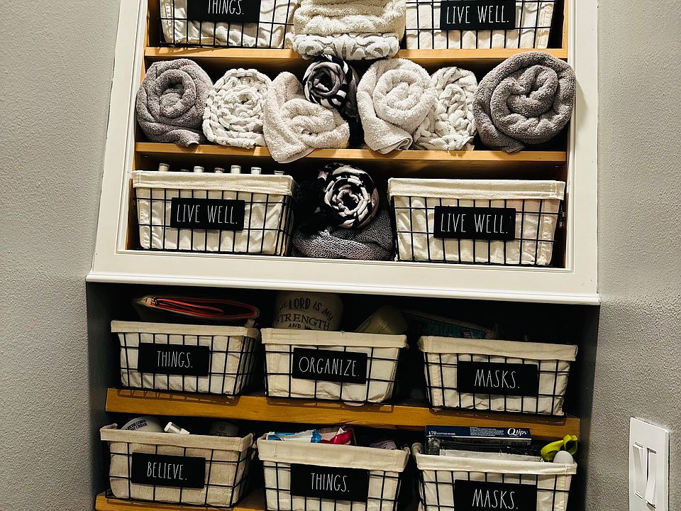 Organized bins in bathroom