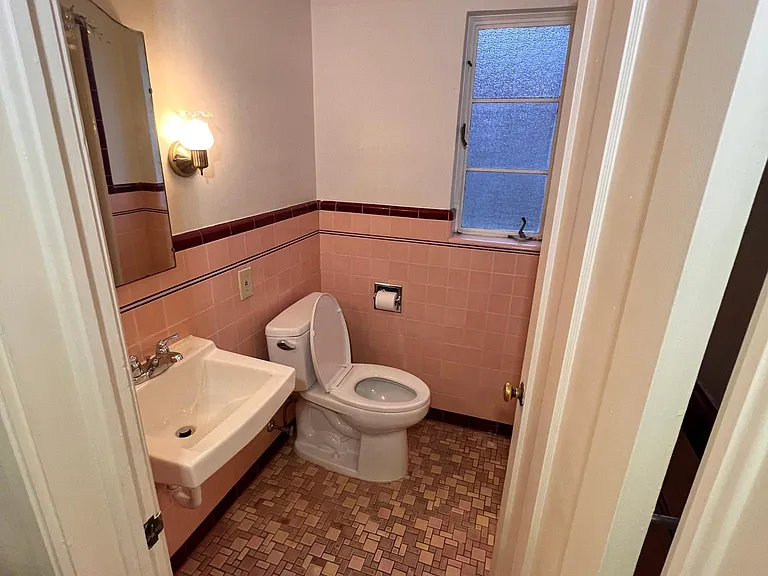 Second bathroom has original art deco tile.