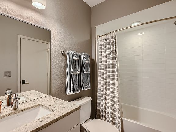 Private basement bathroom next to bedroom.
