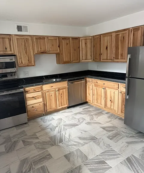 KITCHEN WITH ALL NEW STAINLESS STEEL APPLIANCES