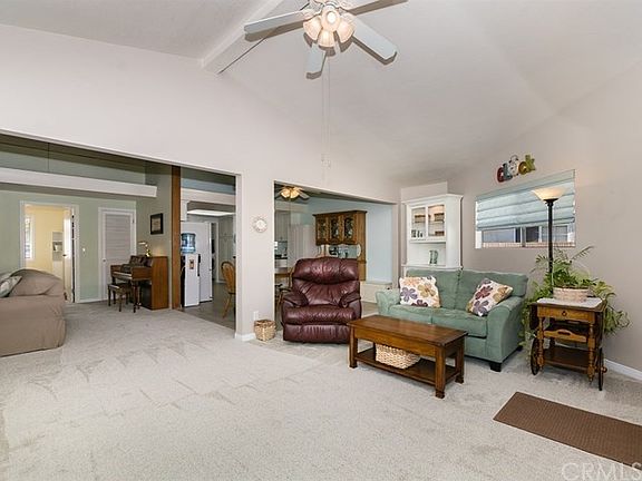 The family room really opens things up! Kitchen in the rear of photo.