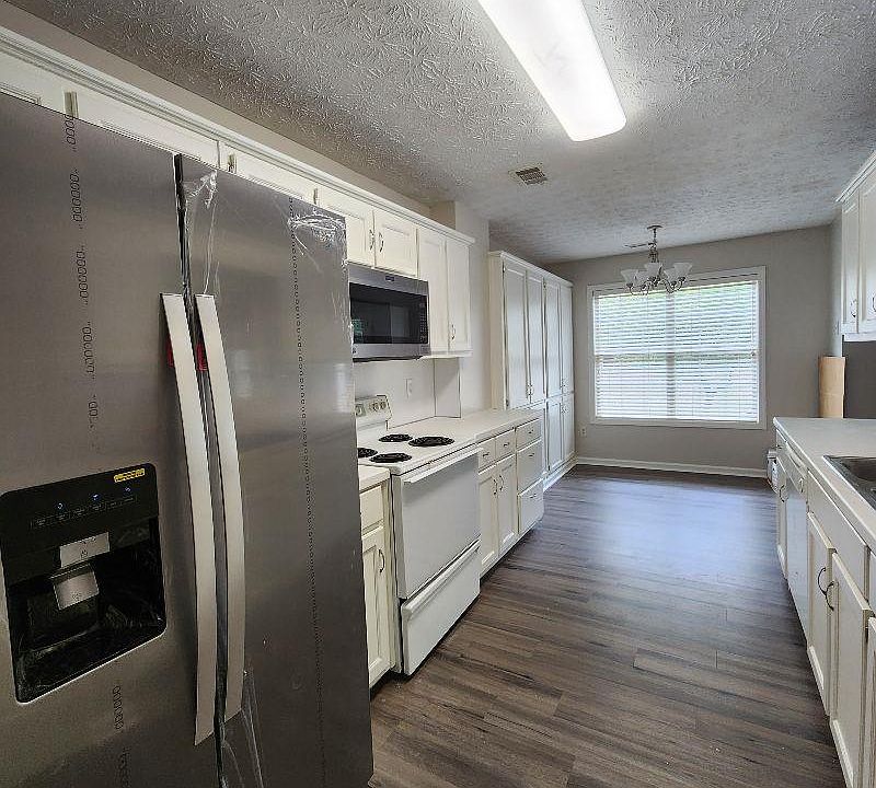 New Refrigerator, Microwave, and Dishwasher

Large kitchen with ample cabinets and drawers