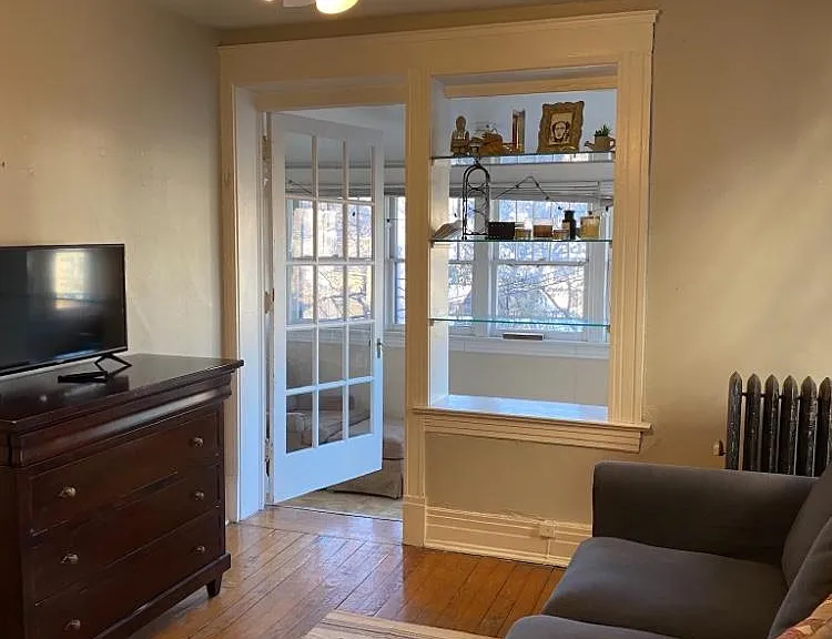 Living room and looking into bedroom/office