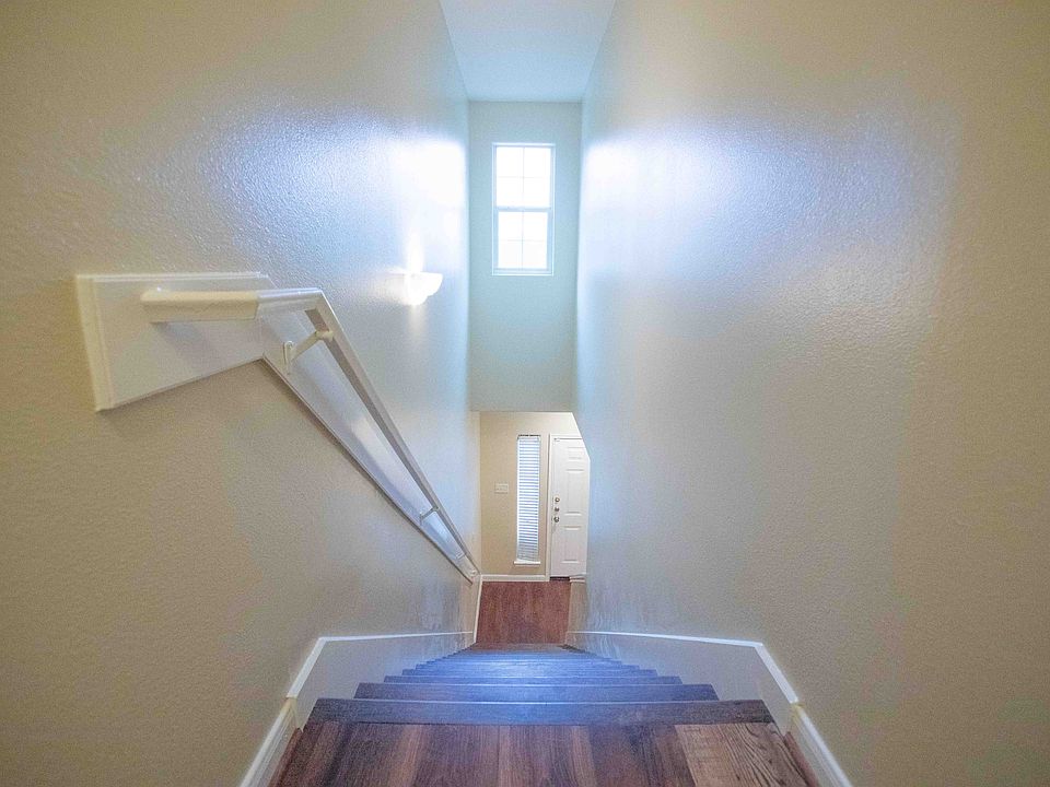 Aerial view from upstairs down the stairs