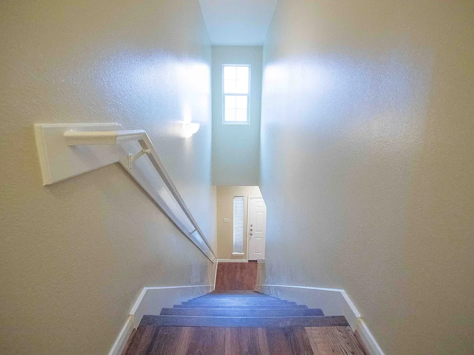 Aerial view from upstairs down the stairs